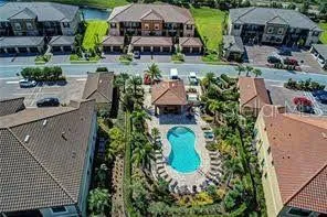a outdoor space with chairs and wooden floor