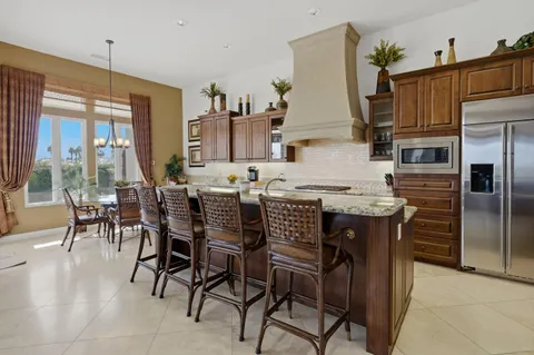 a bed room with a bed and a chair