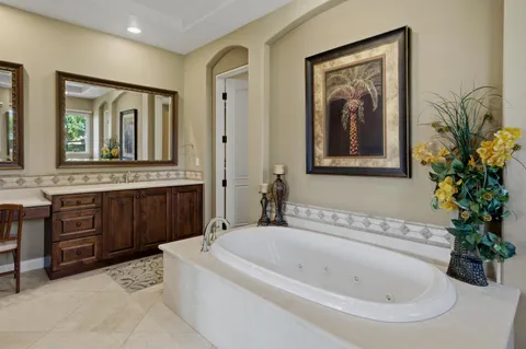 a bedroom with a bed and a lamp on table