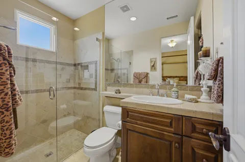 an aerial view of a house with a lake view