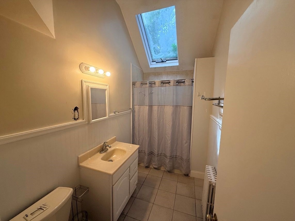 0 Cedar Street, Unit 2 Dedham, MA 02026 - Photo 8 of 11 a bathroom with a sink a toilet and shower