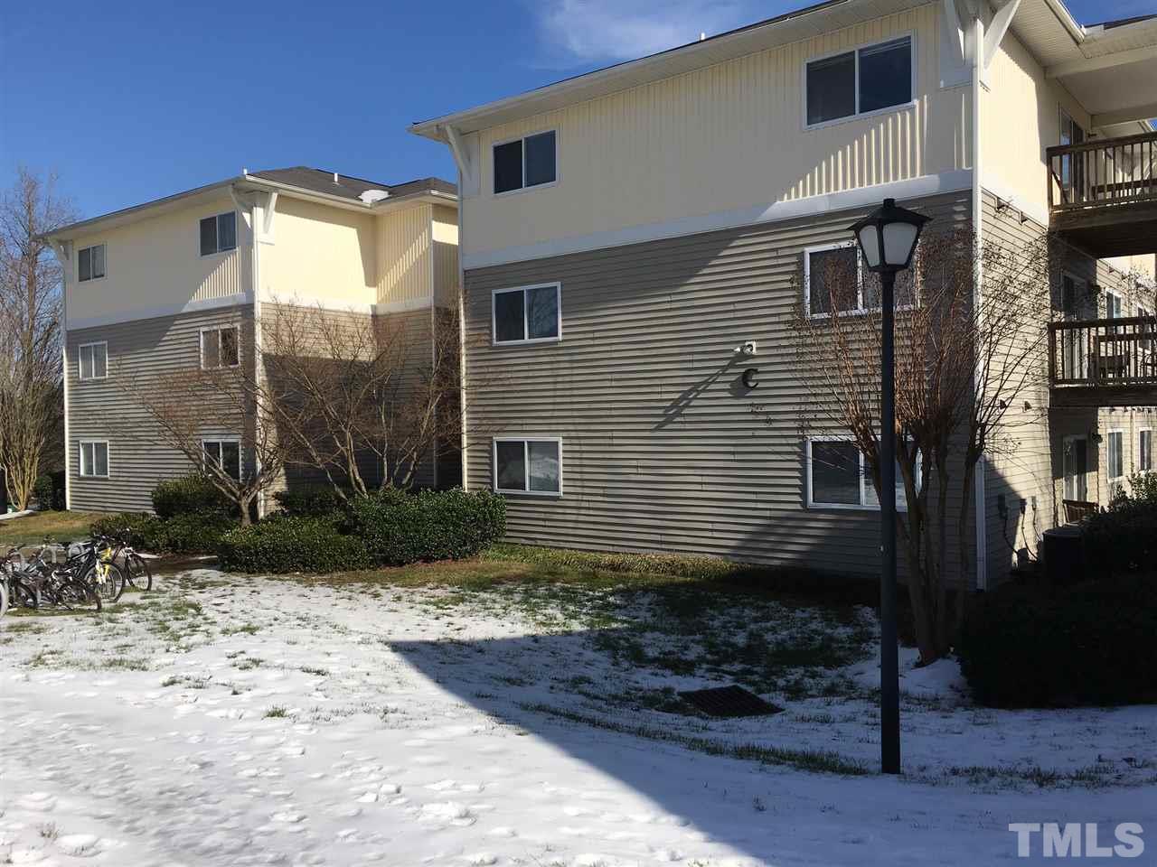 303 Smith Level Road, Unit C13 Chapel Hill, NC 27516 - Photo 2 of 3 a view of a house with a yard