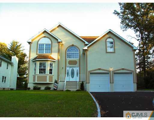 331 Chain O' Hills Road Colonia, NJ 07067 - Photo 1 of 8 a front view of a house with a yard