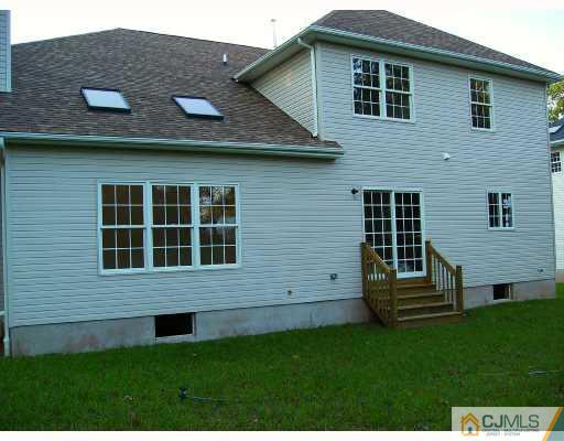 331 Chain O' Hills Road Colonia, NJ 07067 - Photo 8 of 8 a view of a house with a yard