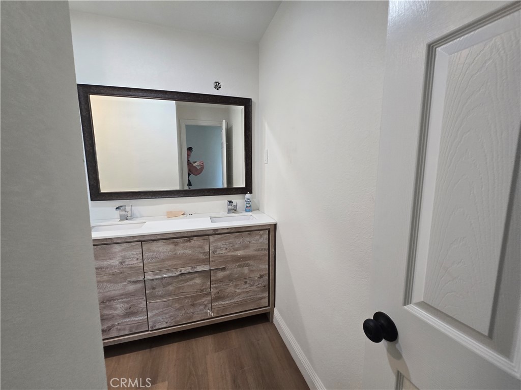 876 River Drive Norco, CA 92860 - Photo 13 of 22 a bathroom with a sink a mirror and vanity