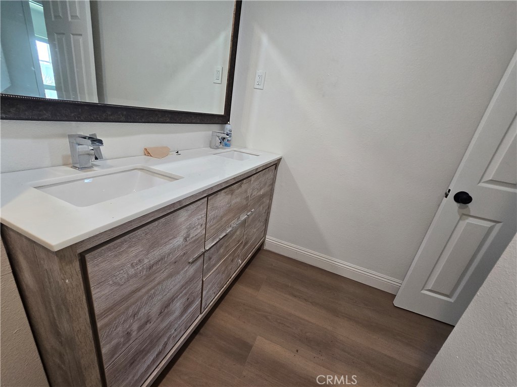 876 River Drive Norco, CA 92860 - Photo 14 of 22 a bathroom with a sink and a mirror