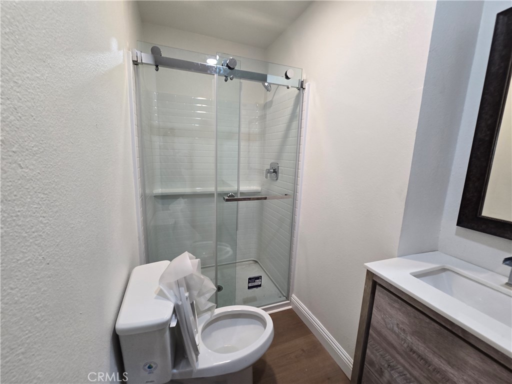 876 River Drive Norco, CA 92860 - Photo 15 of 22 a bathroom with a sink a toilet and shower