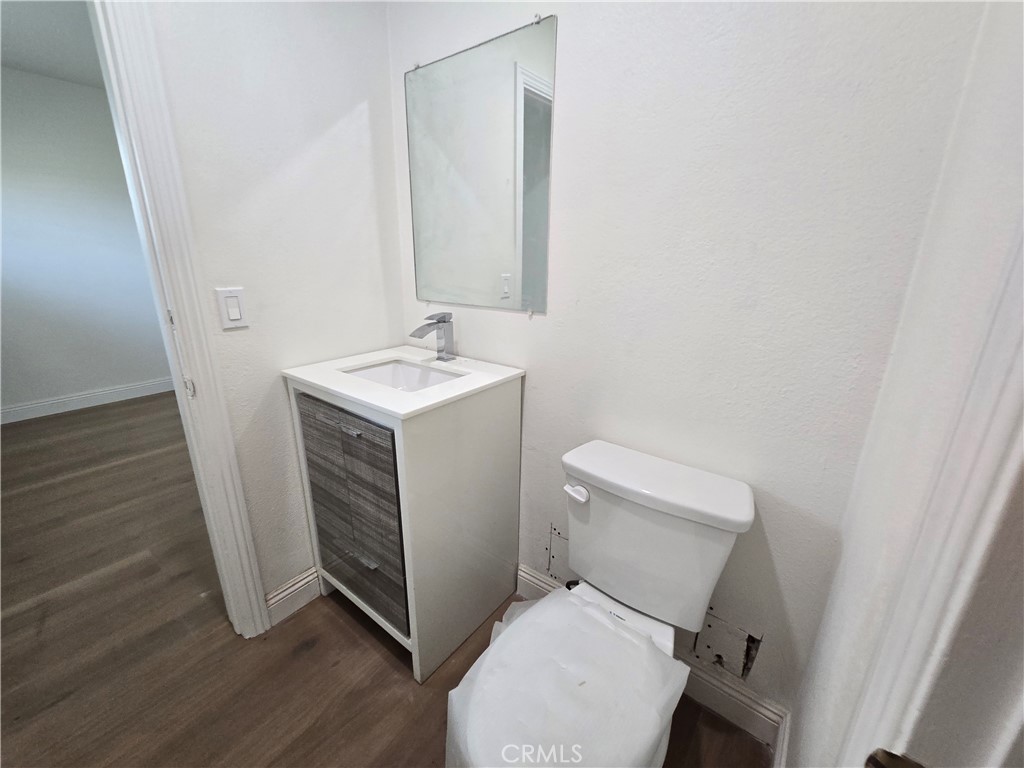 876 River Drive Norco, CA 92860 - Photo 17 of 22 a bathroom with a toilet sink and mirror