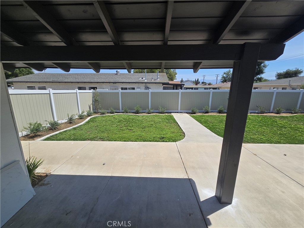 876 River Drive Norco, CA 92860 - Photo 20 of 22 a view of a backyard with table and chairs