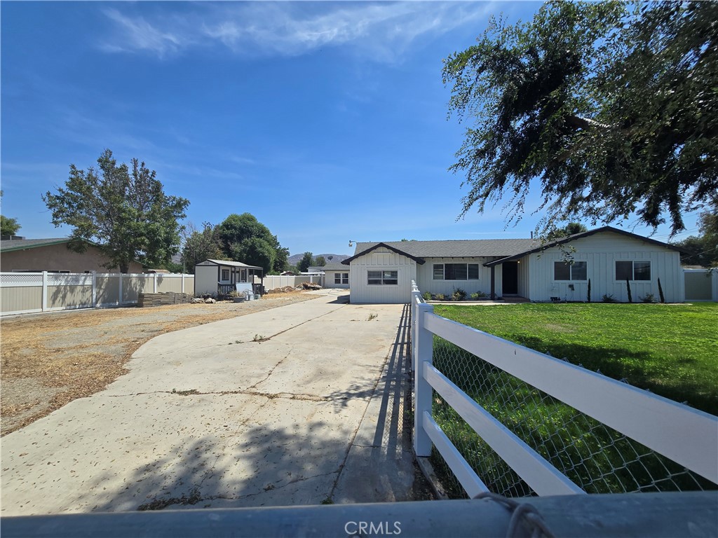 876 River Drive Norco, CA 92860 - Photo 2 of 22 a front view of a house with a yard
