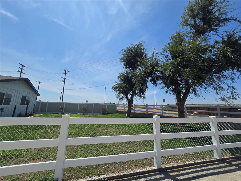 876 River Drive Norco, CA 92860 - Photo 8 of 22 a front view of a house with a yard