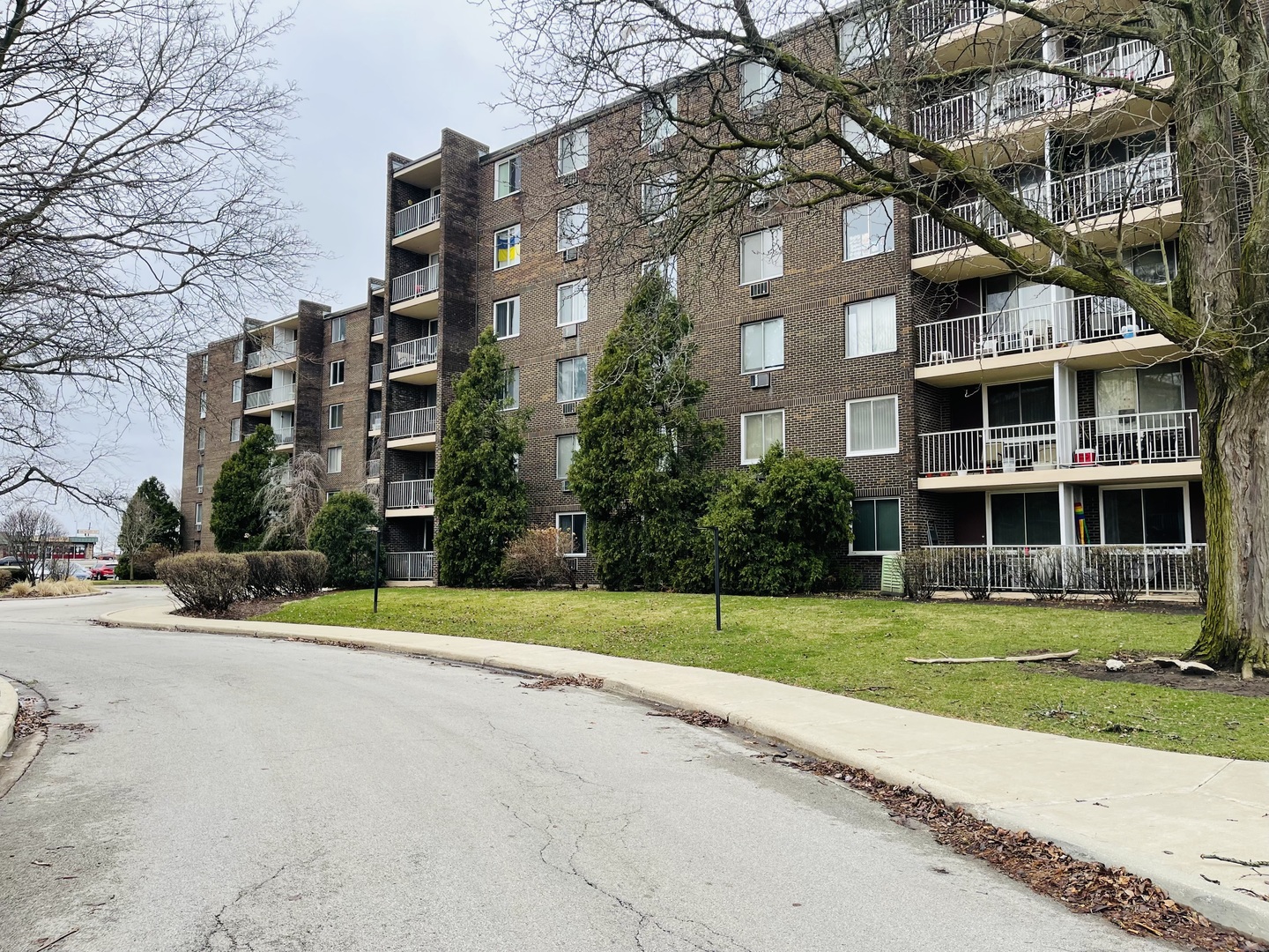 225 South Rohlwing Road, Unit 114 Palatine, IL 60074 - Photo 1 of 18 a view of a building with a yard