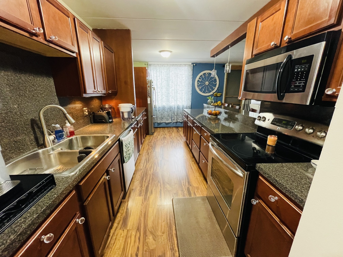 225 South Rohlwing Road, Unit 114 Palatine, IL 60074 - Photo 13 of 18 a kitchen with a sink a stove and cabinets