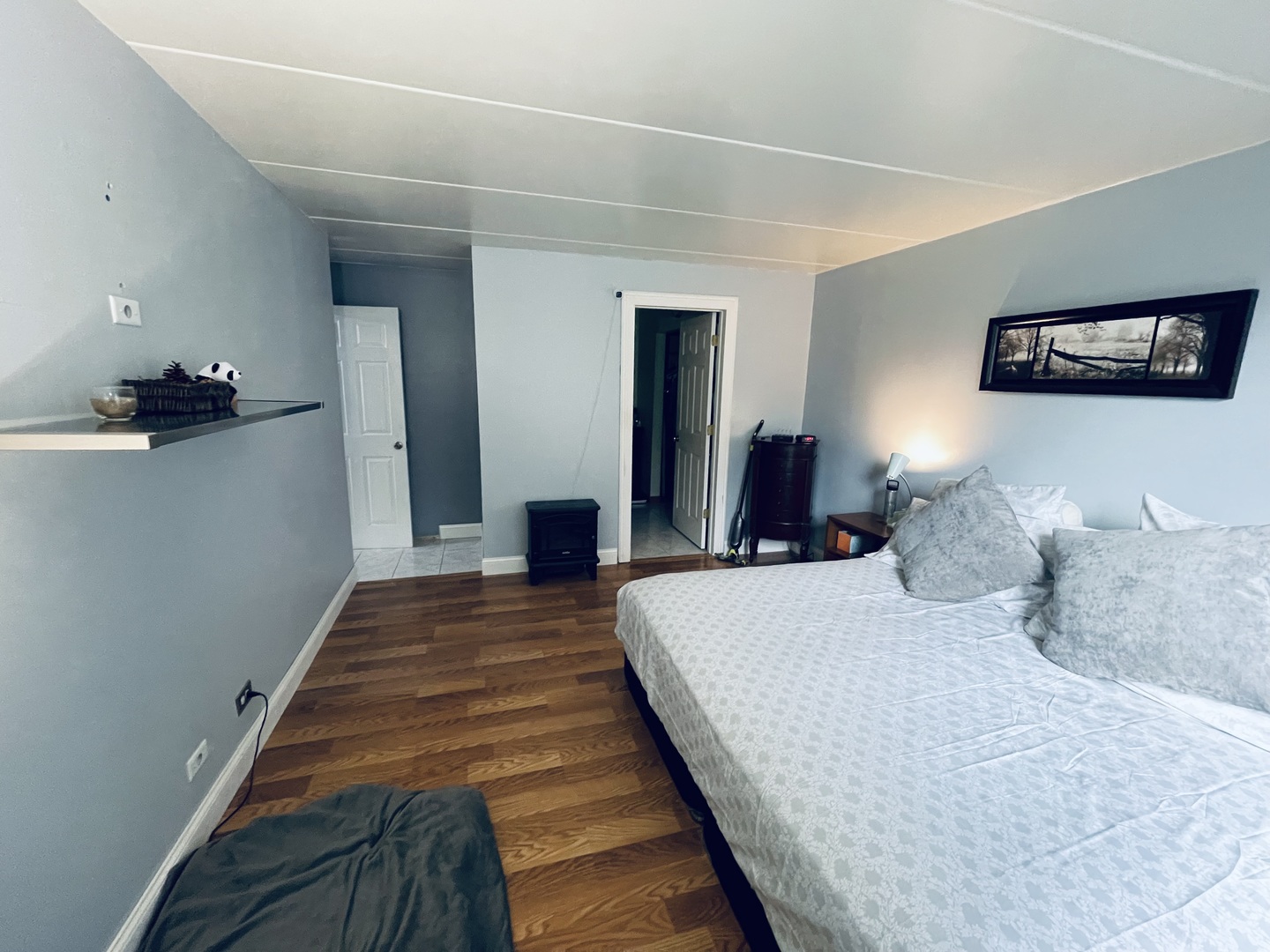 225 South Rohlwing Road, Unit 114 Palatine, IL 60074 - Photo 15 of 18 a bedroom with a bed and a lamp on dresser