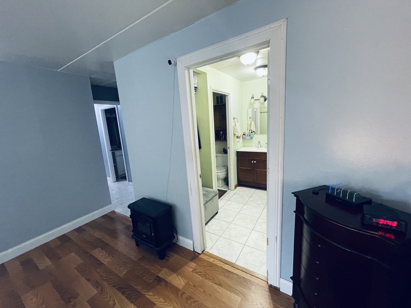 225 South Rohlwing Road, Unit 114 Palatine, IL 60074 - Photo 17 of 18 a bedroom with a bed and a potted plant