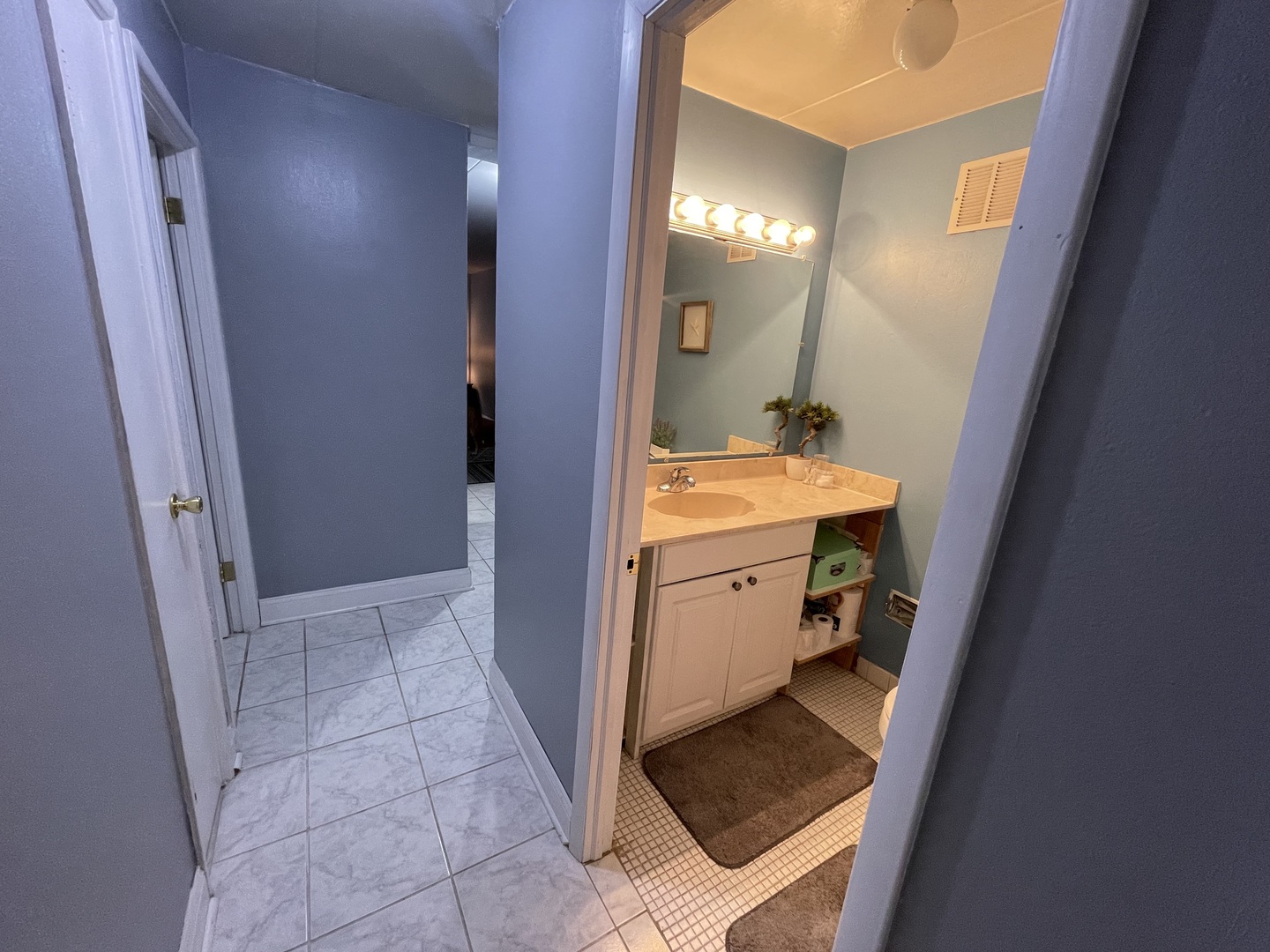 225 South Rohlwing Road, Unit 114 Palatine, IL 60074 - Photo 18 of 18 a bathroom with a sink a toilet and shower