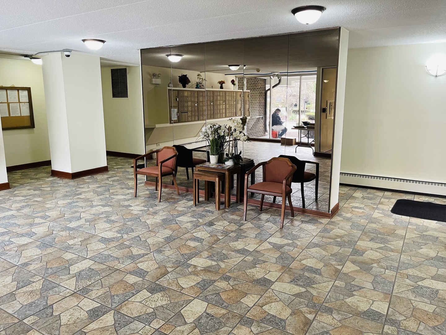 225 South Rohlwing Road, Unit 114 Palatine, IL 60074 - Photo 3 of 18 a view of a dining room with furniture