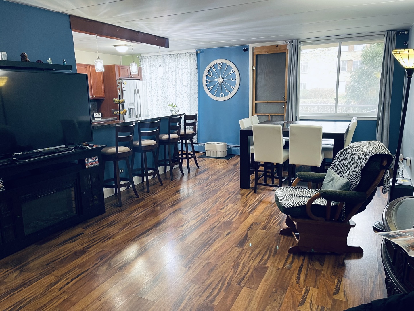 225 South Rohlwing Road, Unit 114 Palatine, IL 60074 - Photo 6 of 18 a living room with furniture and wooden floor