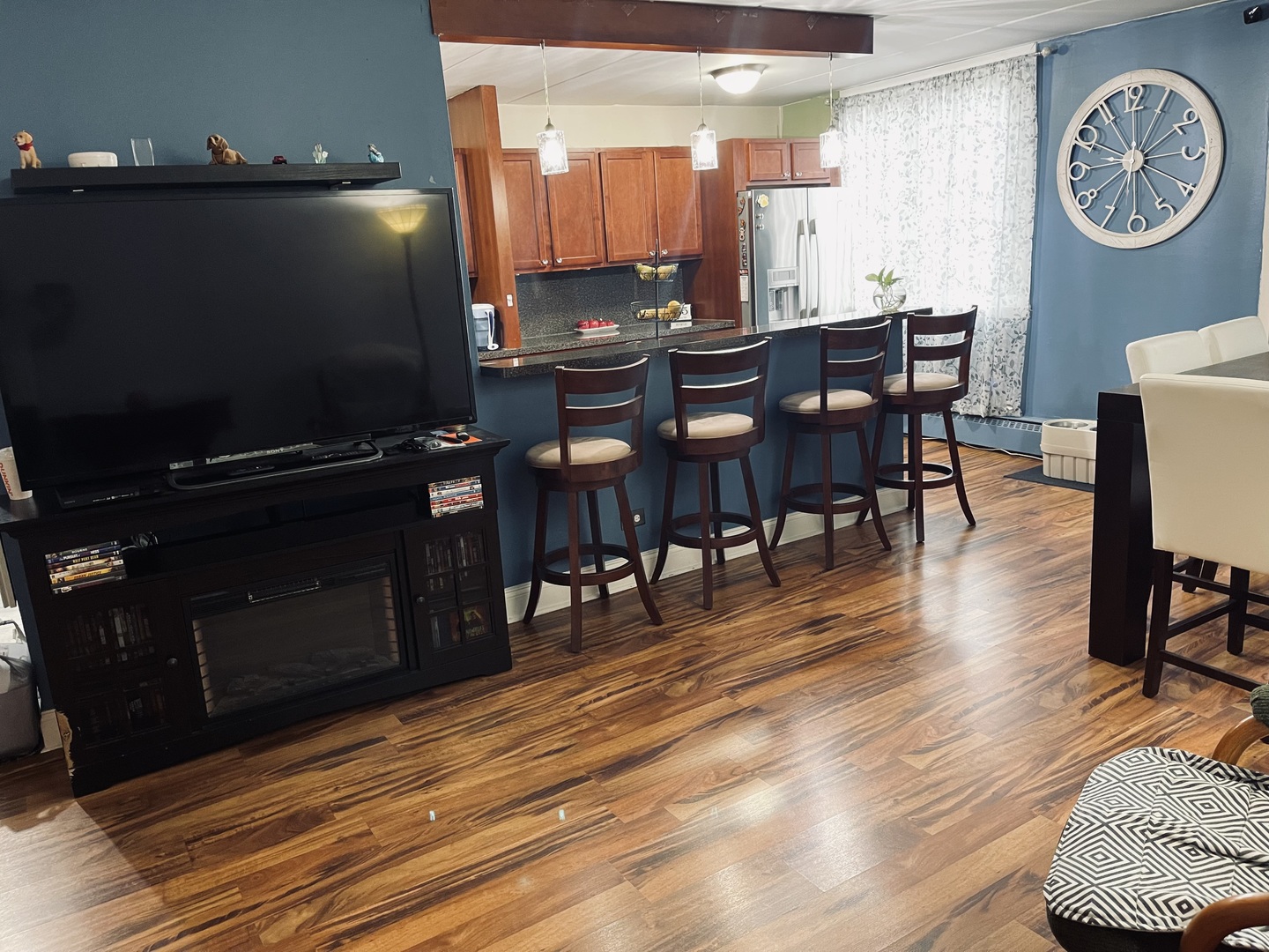225 South Rohlwing Road, Unit 114 Palatine, IL 60074 - Photo 7 of 18 a view of a dining room with furniture and wooden floor