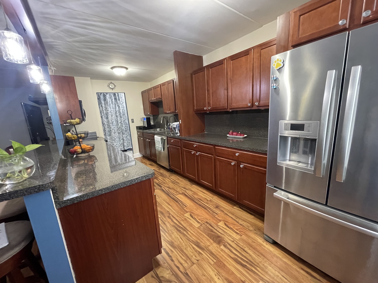 225 South Rohlwing Road, Unit 114 Palatine, IL 60074 - Photo 10 of 18 a kitchen with stainless steel appliances a refrigerator a sink a stove a cabinets and wooden floor