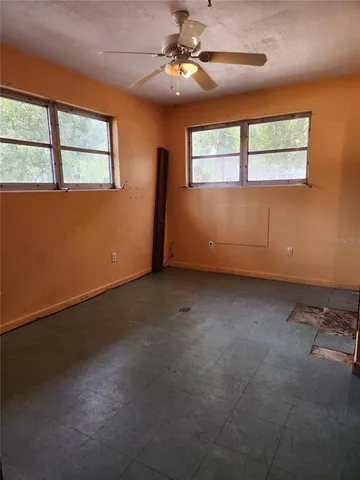 a view of an empty room with a window
