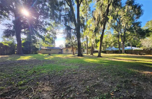 an aerial view of house with yard