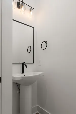a bathroom with a sink and mirror