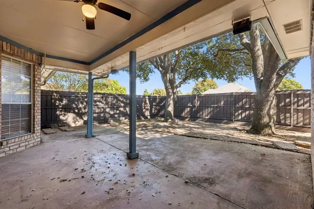 a view of a room with furniture and window