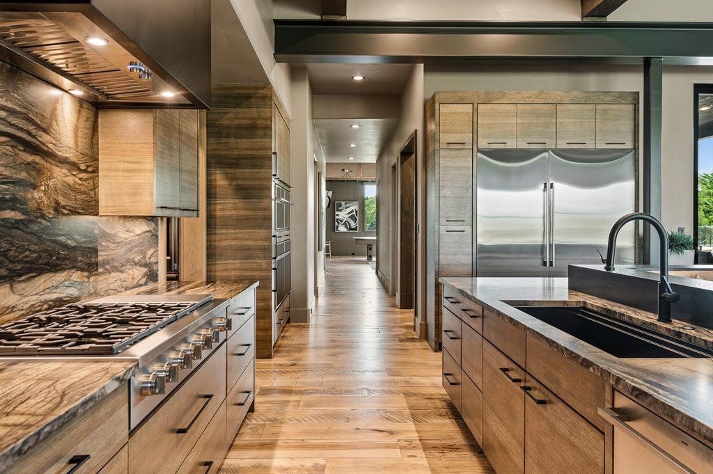 988 English Road Rockwall, TX 75032 - Photo 13 of 40 a kitchen with stainless steel appliances a stove and a refrigerator