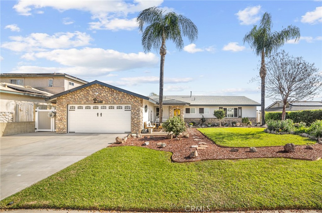 7565 Amethyst Avenue Rancho Cucamonga, CA 91730 - Photo 1 of 1 a view of a house with a garden and patio