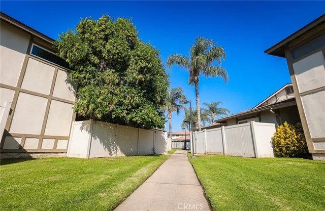 a view of a patio with a table and chairs