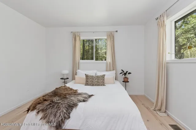 a bedroom with a bed and window