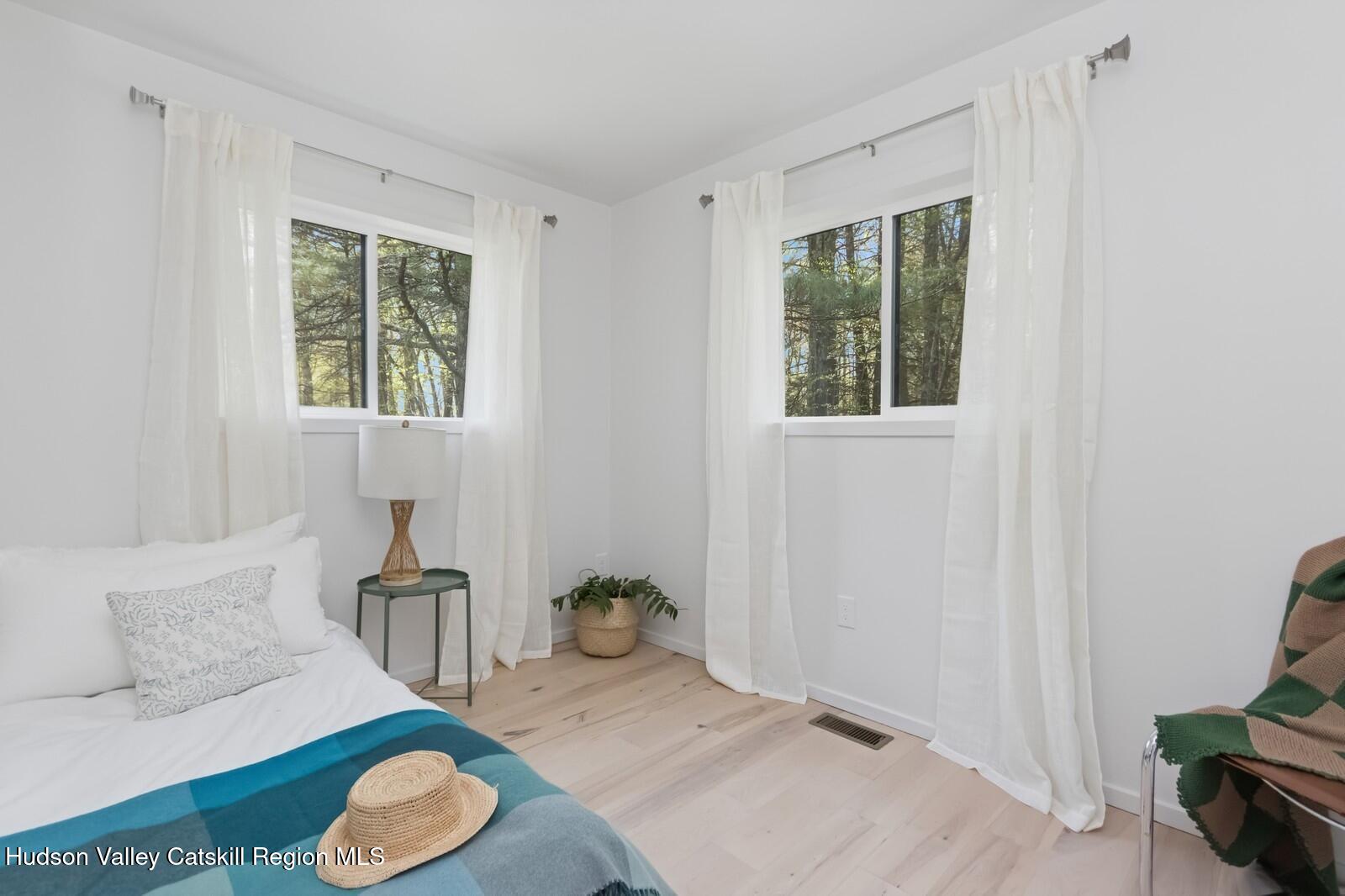 25 Upper Cherrytown Road Kerhonkson, NY 12446 - Photo 19 of 23 a living room with furniture and a window