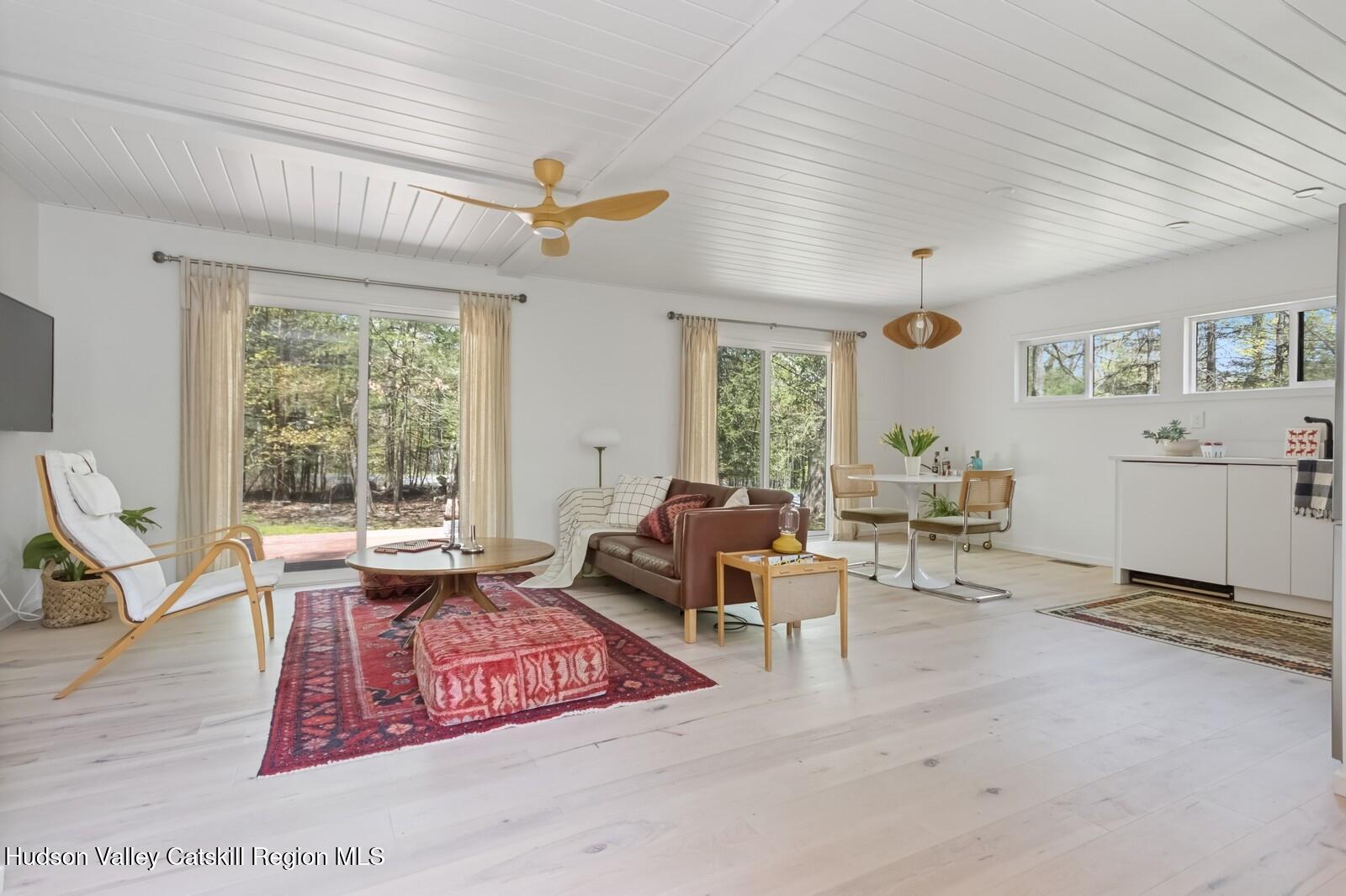 25 Upper Cherrytown Road Kerhonkson, NY 12446 - Photo 21 of 23 a living room with furniture a window and a table
