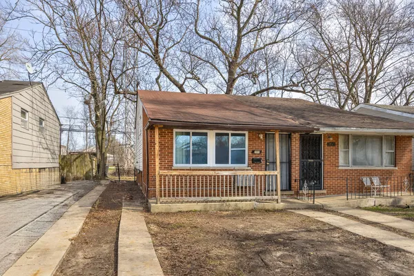 a view of a room with wooden floor and white walls