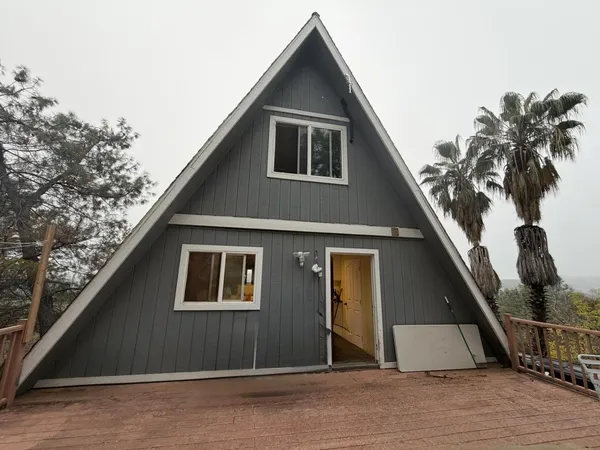 a house with trees in the background