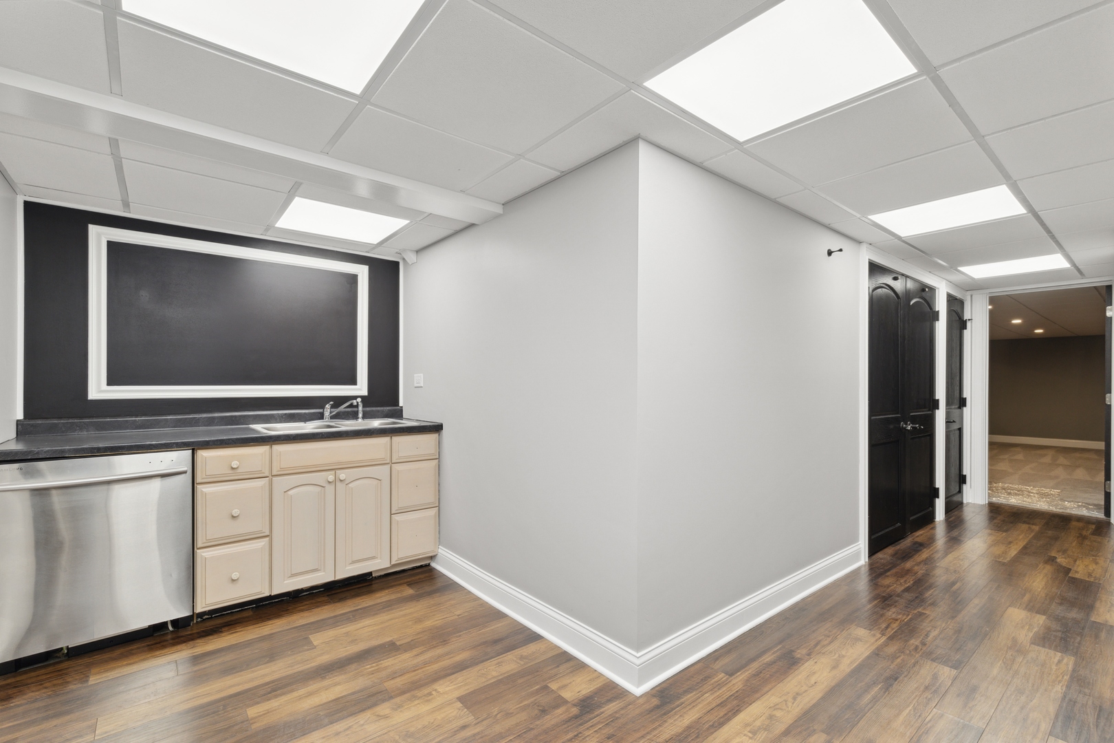 1000 Hollywood Boulevard McHenry, IL 60050 - Photo 13 of 16 a living room with a flat screen tv on wall and a wooden floor