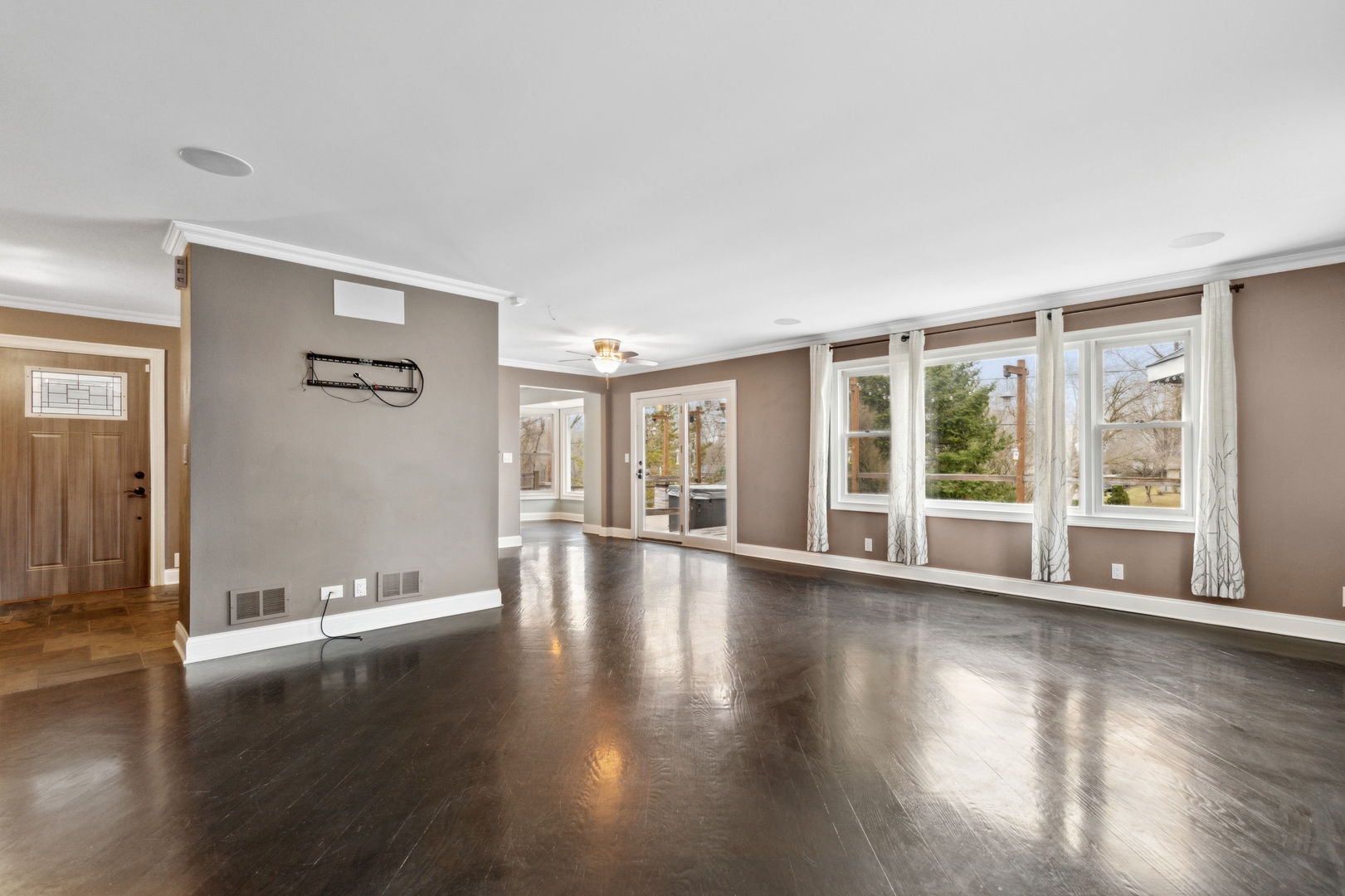 1000 Hollywood Boulevard McHenry, IL 60050 - Photo 3 of 16 a view of an empty room with wooden floor and a window