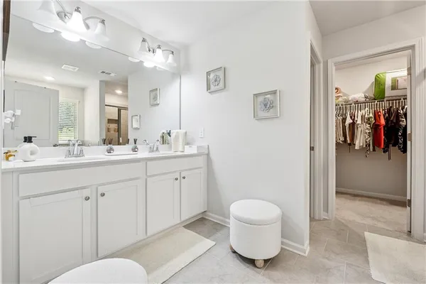 a bathroom with a toilet a sink and a mirror