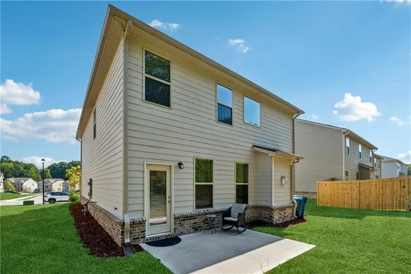 a view of backyard with a garden and deck