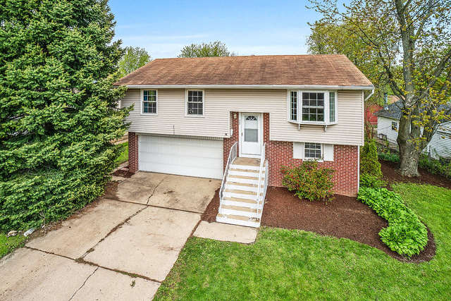 727 Delta Avenue Romeoville, IL 60446 - Photo 1 of 11 a front view of a house with garden