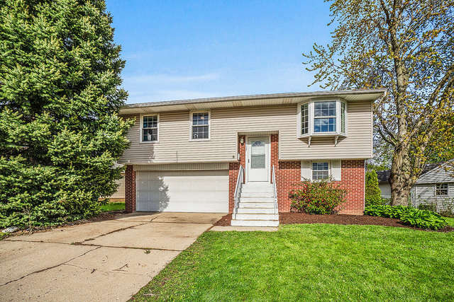 727 Delta Avenue Romeoville, IL 60446 - Photo 2 of 11 front view of a house with a yard