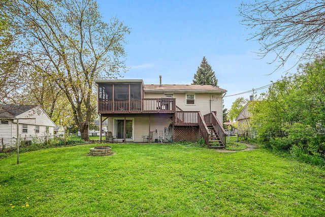 727 Delta Avenue Romeoville, IL 60446 - Photo 11 of 11 a view of a house with backyard and a tree