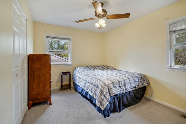 727 Delta Avenue Romeoville, IL 60446 - Photo 6 of 11 a bedroom with a bed and a window