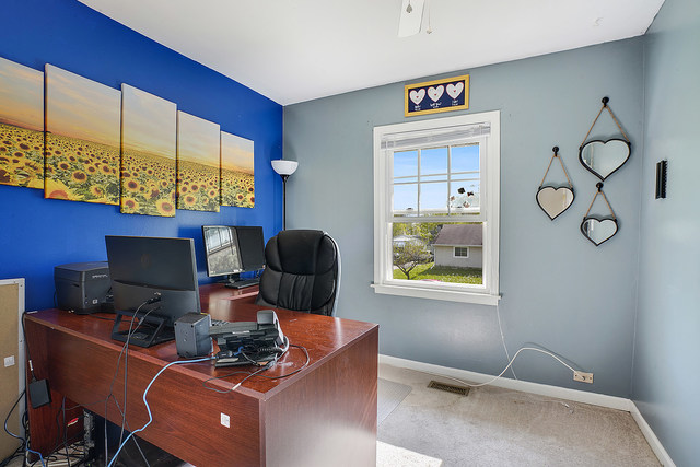 727 Delta Avenue Romeoville, IL 60446 - Photo 8 of 11 a work room with furniture and a window