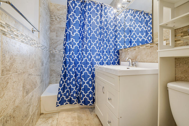 727 Delta Avenue Romeoville, IL 60446 - Photo 9 of 11 a bathroom with a sink toilet and shower