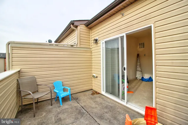a view of a two chairs in the balcony