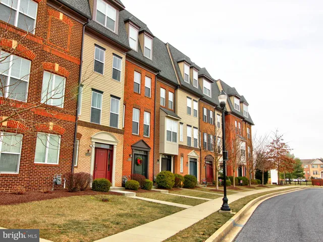 a city street lined with buildings and trees