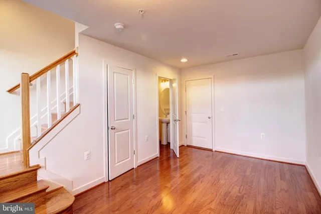 a view of an entryway with wooden floor