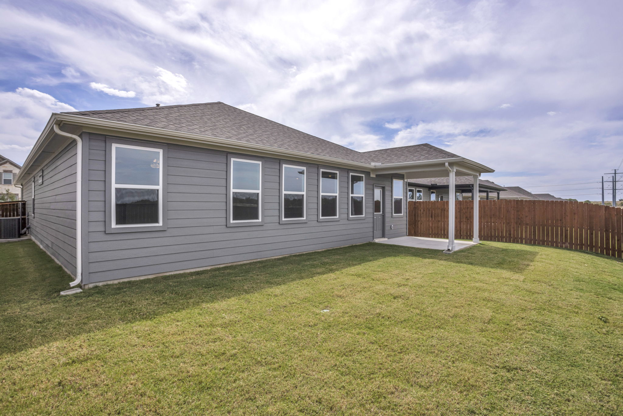 131 Adeline Road Hutto, TX 78634 - Photo 30 of 30 A fenced backyard offers a perfect private outdoor retreat for leisure and entertainment.
